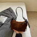 Detail view of a vintage dark brown suede shoulder bag with black strap and zipper - Brown