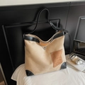 Close-up of contrast stitching and metal buckle on suede leather tote bag - One Size / Khaki