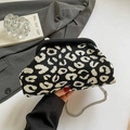 Knitted leopard print crossbody bag with silver chain strap in black and white pattern - Black