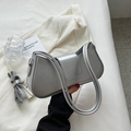 Detail of silver metallic underarm bag with brand embossing and detachable shoulder strap - Silver