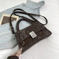 Brown snake pattern faux leather handbag with silver metal buckle and top handle - Brown
