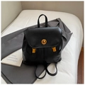 Detail of black textured PU leather backpack with elegant gold twist lock and hardware - Black