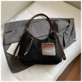 Detail view of large suede tote bag with brown leather straps and ZSKE PARIS patch - Black without Pendant