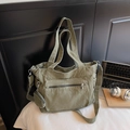 Army green canvas tote bag featuring a front zipper pocket and round coin purse detail - Green