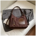 Detail of retro dark brown suede handbag with metal buckle and ZSKE PARIS branding - Coffee without Pendant