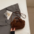 Caramel brown plush bucket bag with leather handles on a minimalist white bedding setup - Brown (Without Pendant)