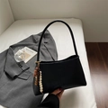 Minimalist black leather underarm bag with unique colorful beaded charm detail - Black
