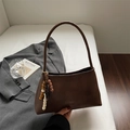 Minimalist dark brown underarm bag with matte finish and stylish wooden bead charm - Brown