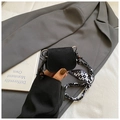 Detail of a black suede mini crossbody bag featuring a checkered silk scarf strap with beads - Style 1 / Black