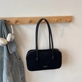 Chic black faux suede shoulder bag with gold logo on a wooden hook with denim jacket - No Pendant / Black