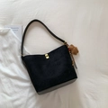 Black suede bucket bag with golden turn-lock, plush bear charm and beaded strap detail - With Charm / Black