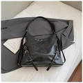 Large black leather tote bag with silver hardware and adjustable straps on a suit - No Pendant / Black
