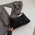 Minimalist black suede underarm bag with gold logo hardware and adjustable strap - Black