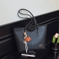 Black litchi grain tote bag with shoulder straps and a cute brown plush bear charm - Black