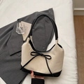 French bucket bag in cream and black contrast with a delicate bow handle detail - Off-white