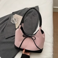 Pink nylon bucket bag with black leather trim and bow knot detail on white fabric - Pink