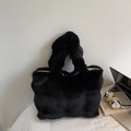 Close-up of black faux fur tote bag with laptop and silver headphones on desk - Black