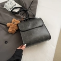 Retro charcoal grey faux leather backpack with MUHETI SHI SHANG lettering and bear charm - Black with Pendant
