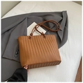 Chic brown woven tote bag with knotted handles on a stylish grey blazer background - Brown No Pendant