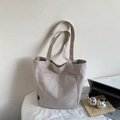 Detailed close-up of beige waterproof nylon tote bag with front pocket and laptop prop - Beige Grey