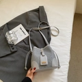 Chic light gray bucket bag with subtle printed texture and gold metal hardware - Silver No Pendant