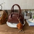 Dark brown retro bowling bag with twin handles and a teddy bear plush charm - With Charm / Brown