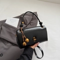 Glossy black vintage handbag with golden sphere pendants and metallic twist lock - With Charm / Black