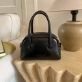 Chic black textured bowling bag with retro pillow shape and stylish dual top handles - No Pendant / Black