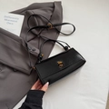 Glossy black leather crossbody bag with gold twist lock and adjustable shoulder strap - No Pendant / Black