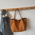 Brown suede tote bag with long leather straps hanging on a wooden hook in a lifestyle setting - Brown No Pendant