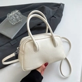 Detail of cream white leather Boston bag with natural pleated texture and silver hardware - Rice White (No Pendant)