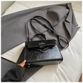 Elegant black oil wax leather Kelly style handbag with top handle and crossbody strap - No Pendant / Black