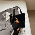 Fashionable black patchwork tote bag with suede texture and orange tassel detail - Black with Pendant