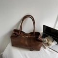 Minimalist dark brown leather tote bag with vintage texture and sleek buckle details - Brown