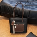 Retro black woven tote bag with brown leather pocket and whimsical chocolate charm accessory - Black