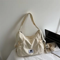 Borsa a tracolla in tela bianco crema con toppa Myron Bear e tracolla regolabile - Bianco Sporco