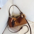 Brown frosted suede underarm bag featuring vintage wooden bead charm and bronze hardware - Coffee with Pendant