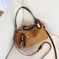 Caramel suede underarm pillow bag with gold ring handle and colorful wooden beads - Brown with Pendant