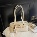 Elegant off-white faux leather tote bag with stylish belt buckle and wooden bead charm - Off-white With Pendant