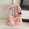 Pink plush bucket tote bag with large bow detail and soft faux fur texture for women - Pink
