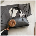 Detail of black matte PU leather boston bag with plush pendant and lace ribbon decor - Black