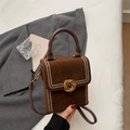Dark brown suede crossbody bag with golden rivet trim and elegant metallic lock - Brown