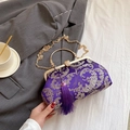 Elegant purple silk evening bag with silver floral embroidery and golden metal handle - Purple