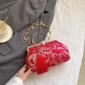 Elegant red satin shell bag with gold embroidery, tassel detail, and chain strap - Red