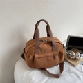 Brown canvas boston handbag for women with multi-pocket design and crossbody strap - Brown