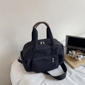Versatile black nylon shoulder bag with brown leather handles and adjustable strap - Black
