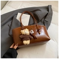 Vintage dark brown faux leather shoulder bag with a gold logo and cute bear charm - Yellowish Brown With Pendant