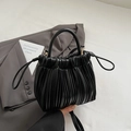 Minimalist black ruffled cloud bucket bag with circular handle and detachable strap - Black
