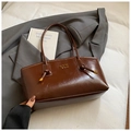 Minimalist brown oil-wax leather tote bag with elegant metallic logo and braided details - Brown No Pendant