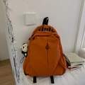 Detail of orange nylon backpack with black lima logo and cute white puppy plush charm - With Charm / Orange
